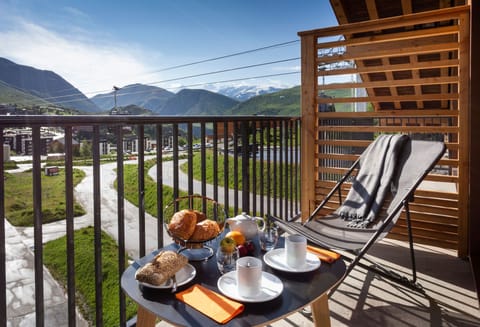 Start your day with coffee and croissants overlooking the peaceful valley below.