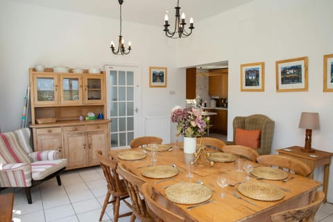 Dining room with Welsh Dresser and table seating 8