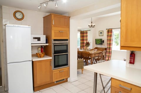 Kitchen with fridge/freezer, electric oven and hob