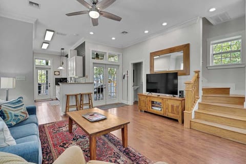 Main House Living Room: Bright and airy space with stylish decor, perfect for relaxation and fun together!