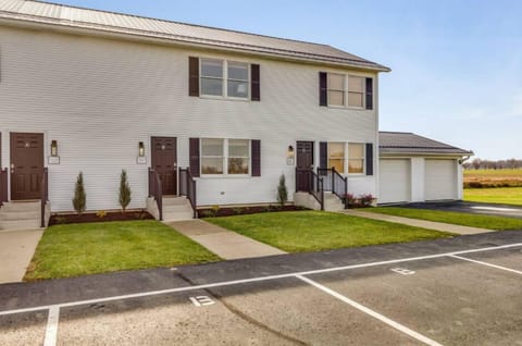 This is a Tri-plex building. The parking lot is shared, however there are dedicated parking spaces available for each unit.