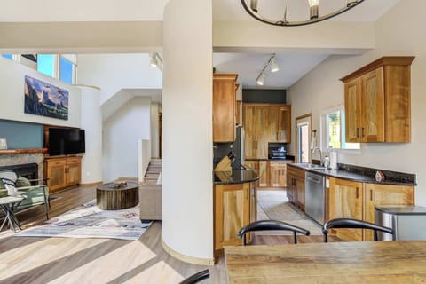 Open layout seamlessly connecting the kitchen, dining, and living areas for effortless entertaining and relaxation.