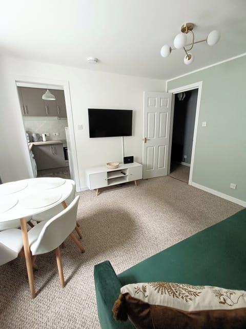 Living room with double sofa bed and flat screen TV