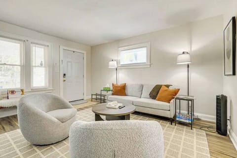 Spacious living room with large smart tv and open concept floor plan. 