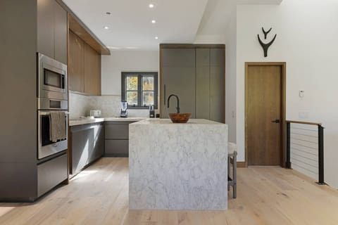 Kitchen features Microwave, Oven, Electric Cook Top, Refrigerator with Icemaker and Dishwasher.