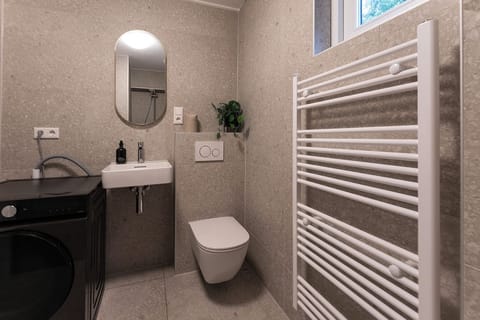 Bathroom via shared-hallway