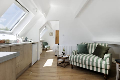 The open-plan living space leads onto the the bedroom