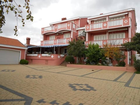 Relax and unwind on the terrace of Villa Apoloniazadar. You can also see the sea not far away