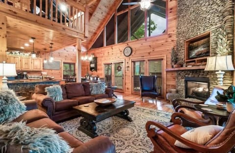 Step into comfort! Our living room boasts high vaulted ceilings and a warm, inviting space to unwind.