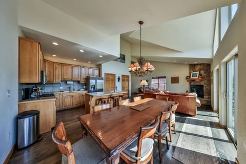 Spacious, open floor plan with large windows and vaulted ceilings