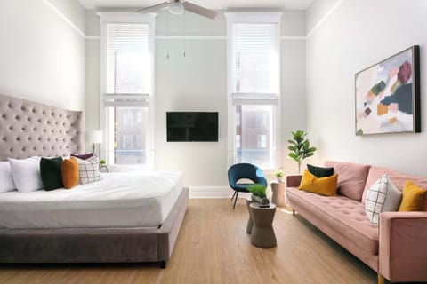 Bright and stylish bed, sofa, and modern décor