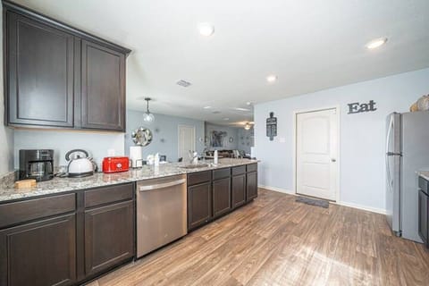 Fully equipped kitchen with modern appliances and plenty of counter space.