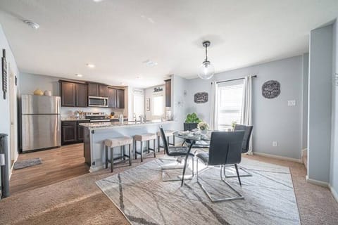Open kitchen and dining area designed for cooking and entertaining.