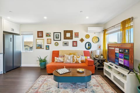 Sink into the vibrant, sunny living room and put your feet up after a long day.