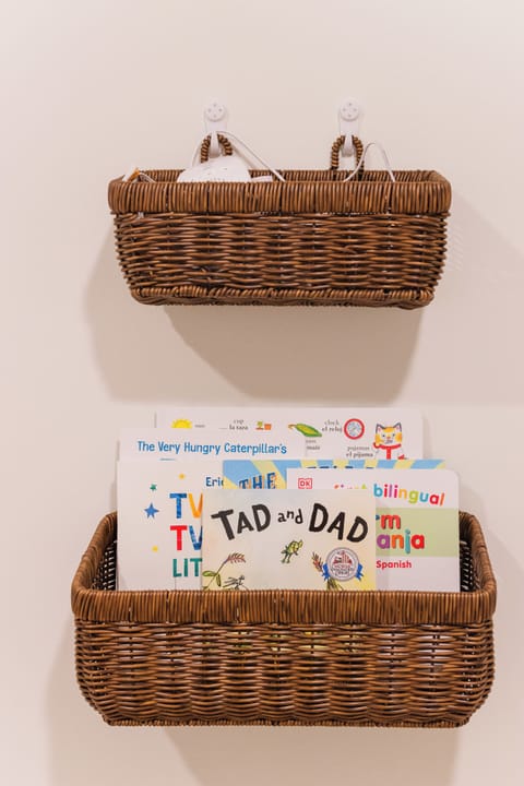 Books, sound machine, & baby monitor available for parents of little ones.