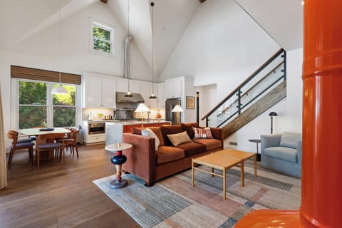 The open concept kitchen, dining and living room