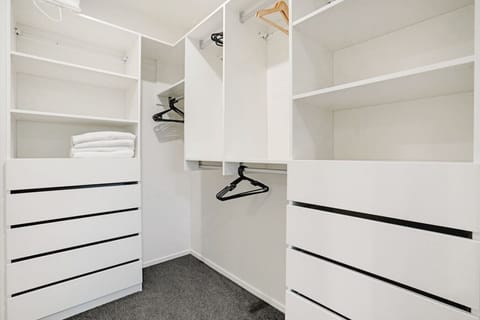There is plenty of storage in the walk-in wardrobe for all your personal belongings.