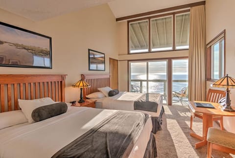 This charming 2 Queen Bedroom features two cozy queen beds, a panoramic balcony with stunning ocean views, and a relaxing sitting area for added comfort.