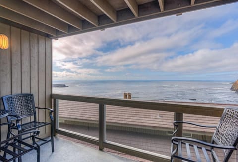 Enjoy breathtaking ocean views from the private balcony, furnished with comfortable chairs, perfect for relaxing while taking in the coastal scenery.