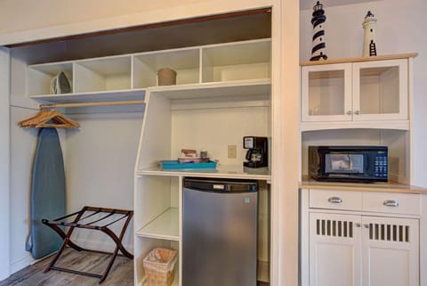 This nook with modern appliances, such as a mini fridge and microwave, ensures a convenient stay.