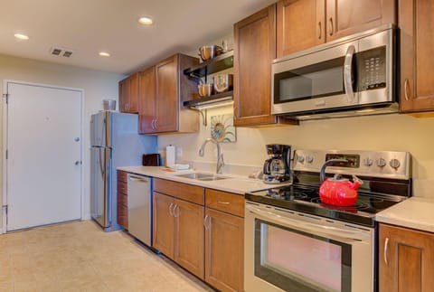 Equipped with stainless steel appliances and stylish cabinetry, the full kitchen offers everything you need to prepare meals during your beach getaway.