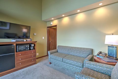 The modern seating and in-room amenities in this mini suite provide a perfect blend of comfort and convenience for guests enjoying their oceanfront stay.