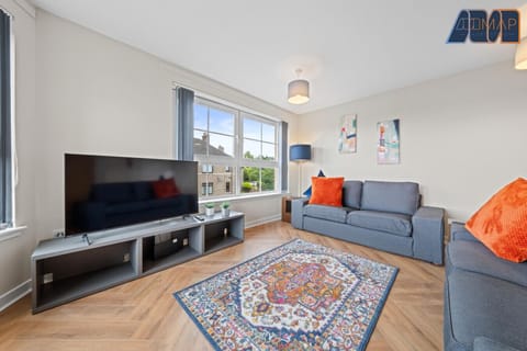 Relax in style with a spacious lounge featuring a comfy 2-seater and 3-seater sofa, plus a 65" Smart TV — perfect for unwinding after a long day.