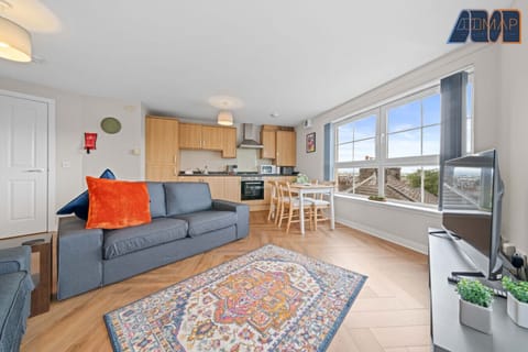 Relax in style with a spacious lounge featuring a comfy 2-seater and 3-seater sofa, plus a 65" Smart TV — perfect for unwinding after a long day.