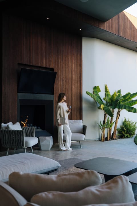 Enjoy the outdoor patio equipped with standing heaters and a fireplace