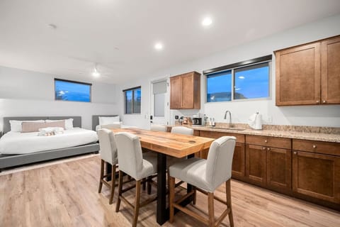 Guest suite kitchenette with seating for guests