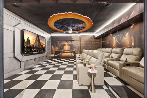 🎥Enjoy a cinematic escape with 11 plush reclining chairs featuring extendable footrests for ultimate comfort. Equipped with a massive screen, surround sound, and cozy lighting—perfect for family movie nights or binge-watching your favorite shows in style.