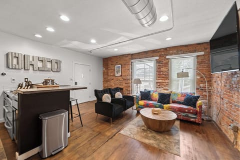 Curl up in the chic living room & stream your favorites on the smart TV​