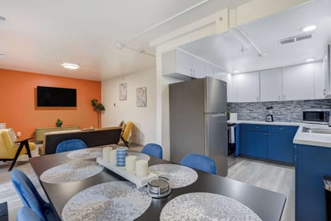 Open-concept design connecting the dining area, modern kitchen, and cozy living room, ideal for gathering with family and friends.