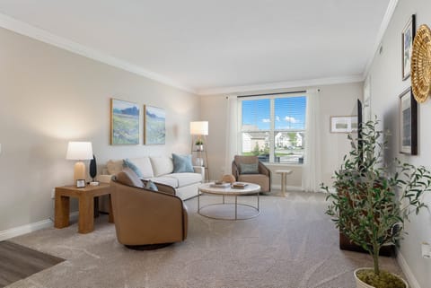 Designer Living Room with Arhaus Furniture – Relax in style with elegant Arhaus furnishings that make this Liberty Grand apartment truly stand out.