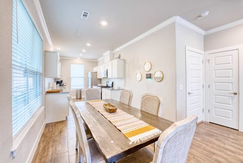 Fully equipped kitchen with stainless appliances, coffee bar & breakfast island—everything you need to cook & connect.