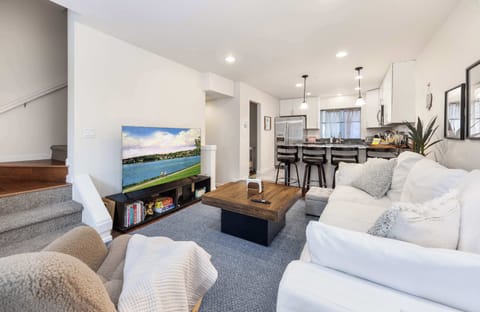 Relax with your favorite shows or enjoy meals together in this open layout.