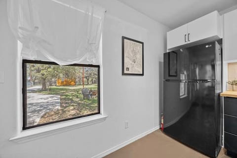 The refrigerator stands as a quiet sentinel in the kitchen, sleek and modern, yet with a hint of nostalgic charm.