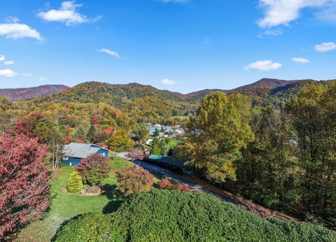Private mountain retreat with colorful foliage and open yard
