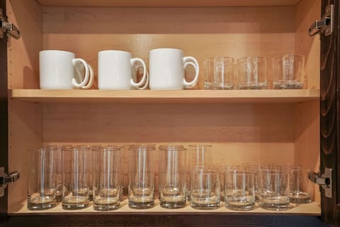 Plenty of cups and mugs in the kitchen cabinets !