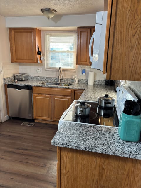 Kitchen with dishwasher, pots & pans to cook up something delicious.