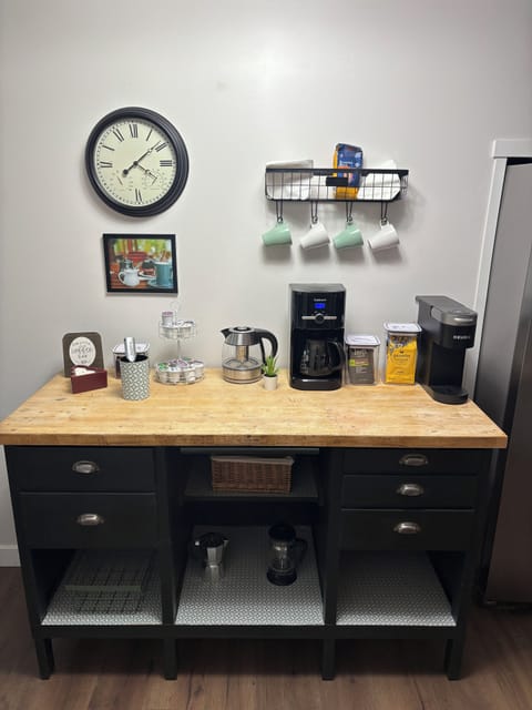 Fully stocked coffee & tea bar with Moka pot, electric kettle, drip coffee maker