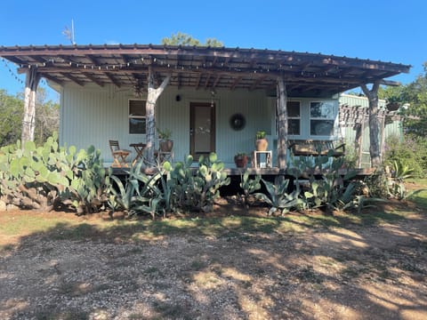 Sip your coffee on this lovely front porch.