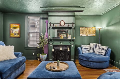 Living Room - Bottom Unit: Lights, camera, relaxation! ✨ Get ready for epic movie nights on our projector TV, all from the comfort of this plush living room.