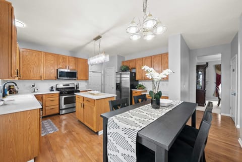 The airy kitchen offers ample space & all the comforts of home