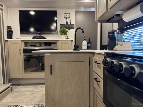 Bears Den view into the kitchen and living room — where cozy corners meet shared spaces.