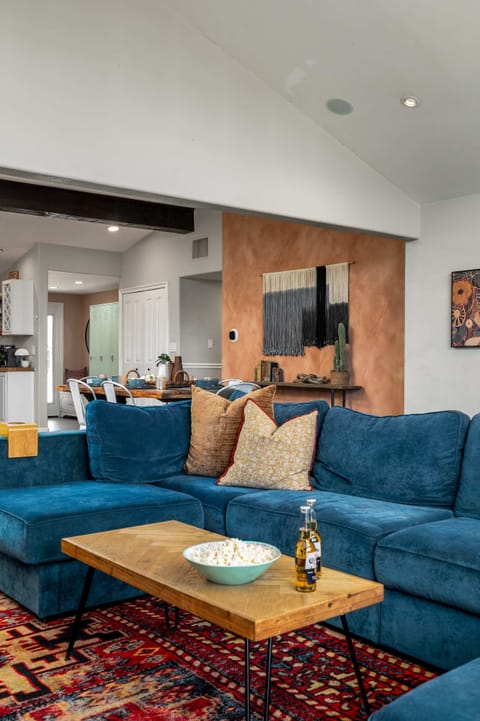 Living room 1 with ceiling fan, TV, large windows