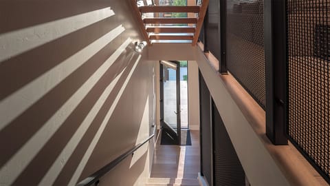 View down the stairway to the street-level entry