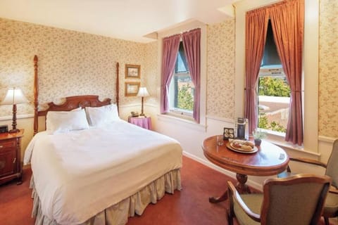 Unwind in a cozy bedroom with classic charm and soft light.