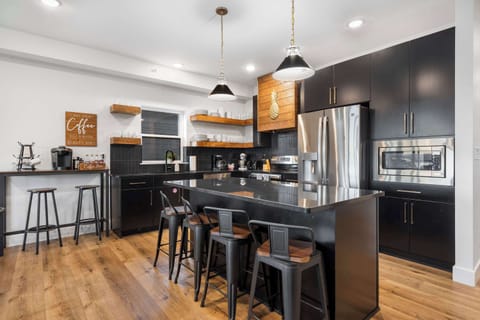 Unit 360’s chic, open kitchen offers ample space & every home comfort