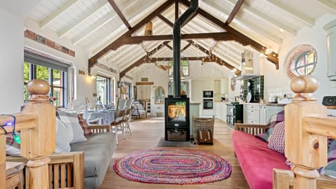 The main seating area flanks the woodburning stove making it a cosy spot.